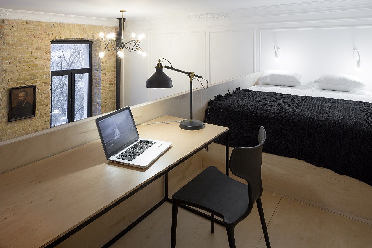 Loft level bedroom and work area feels simple and minimal