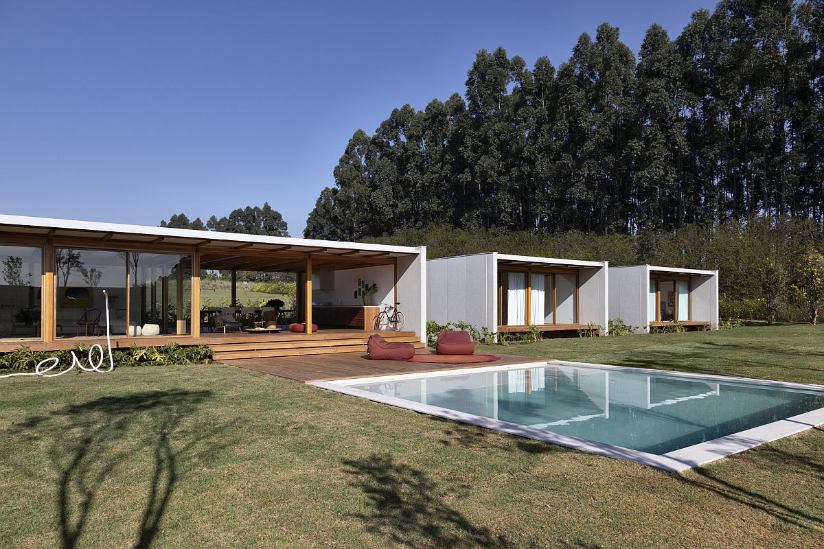 Minimal wooden deck and pool extend the interior outside withou any hassle