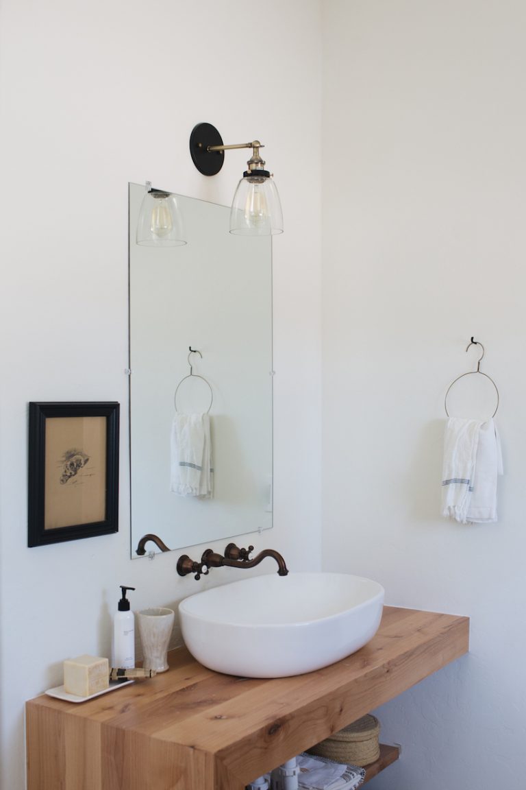 Minimalist cottage bathroom with dark and light details