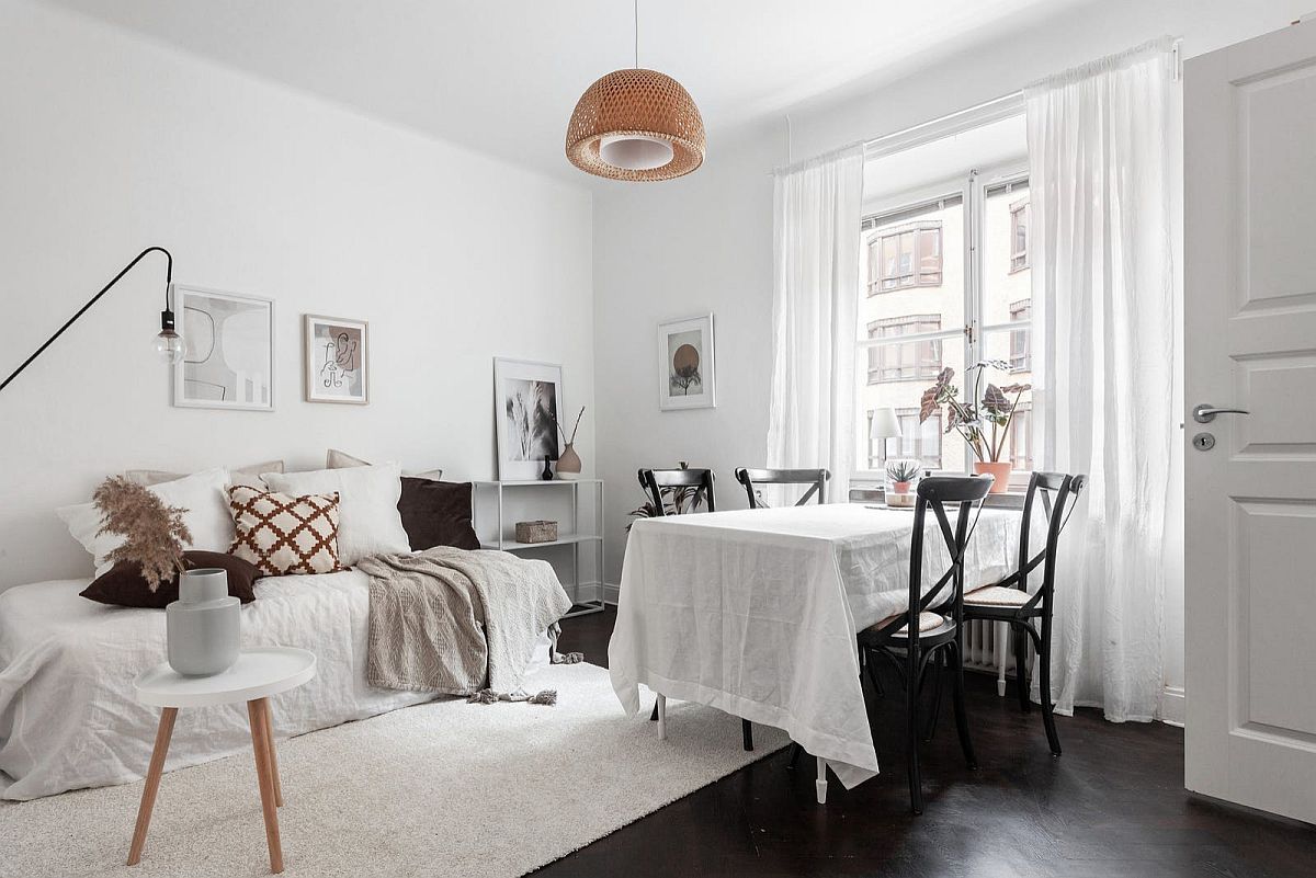 Modern Scandinavian style dining area inside the tiny apartment feels both casual and stylish