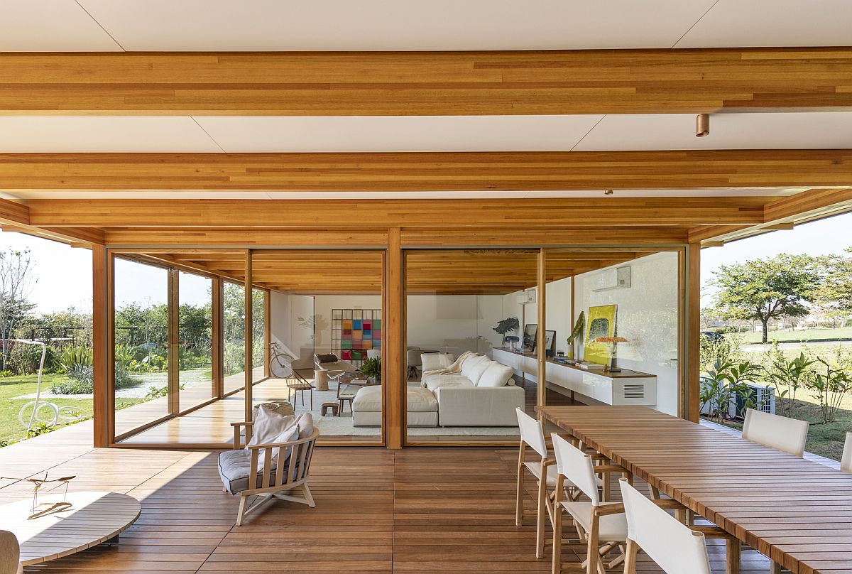 Open plan living area, kitchen and dining space of contemporary Brazilian home