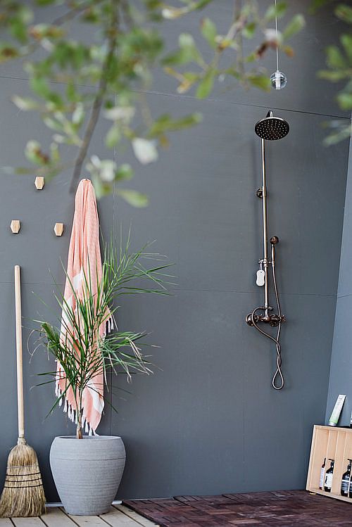 Outdoor shower area at the cabin in woods with distant views