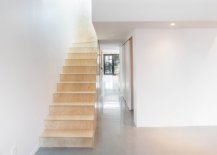 Plywood-furniture-and-staircase-inside-the-white-revamped-Artists-apartment-in-France-61399-217x155
