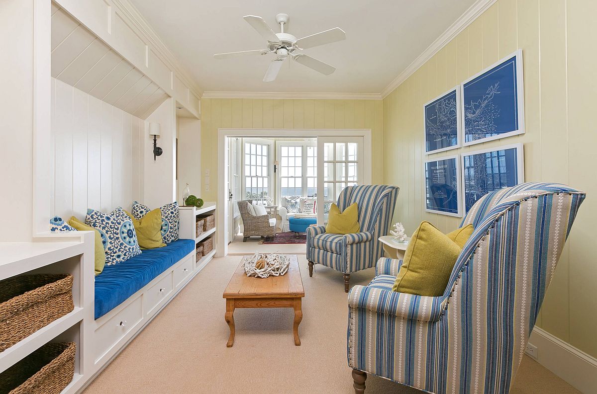 Remodeled modern beach style living room in light yellow and blue is a showstopper