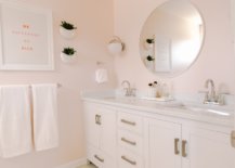 Round-white-mirror-in-a-blush-bathroom-17008-217x155