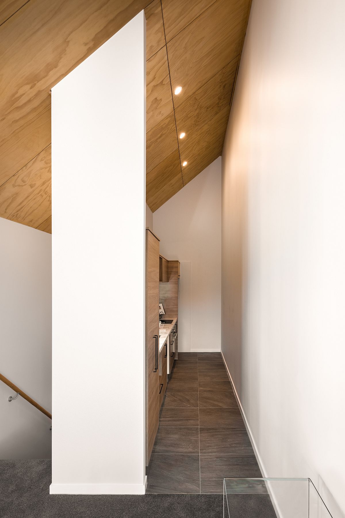 Small and narrow kitchen in wood and white