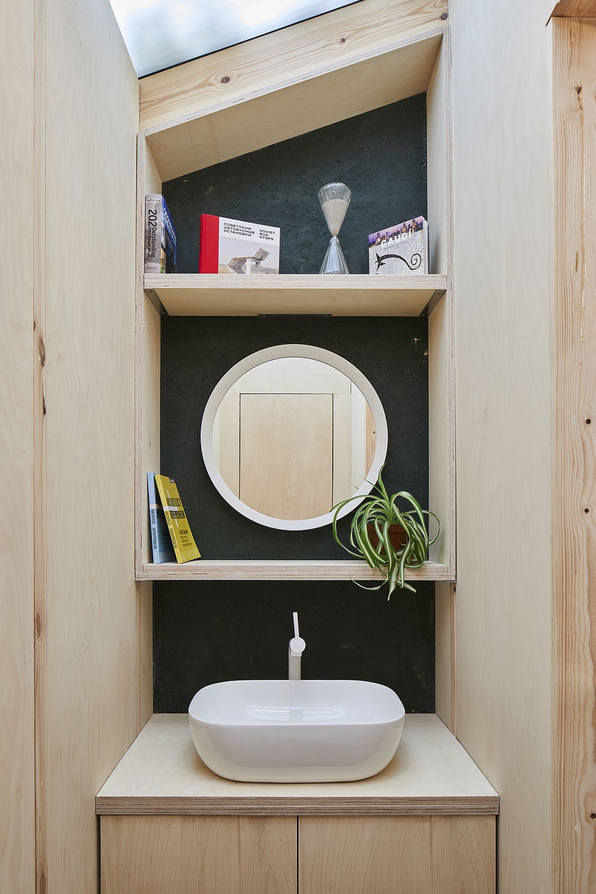 Small bathroom and sink inide the home office shed with limited space