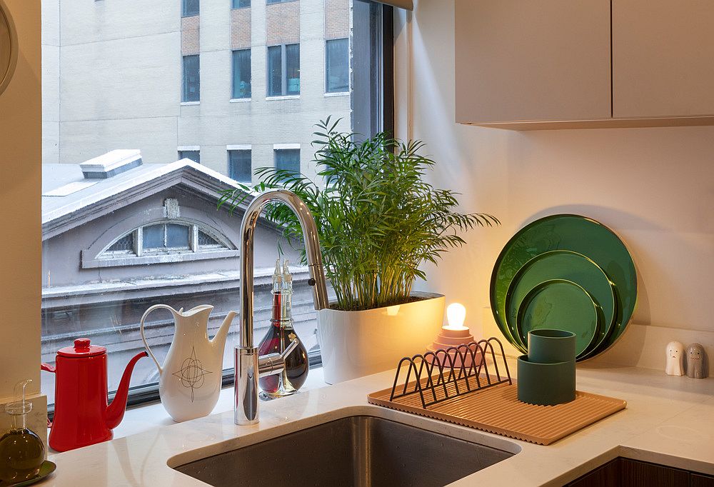 Small kitchen with window at the corner that ushers in ample natural light