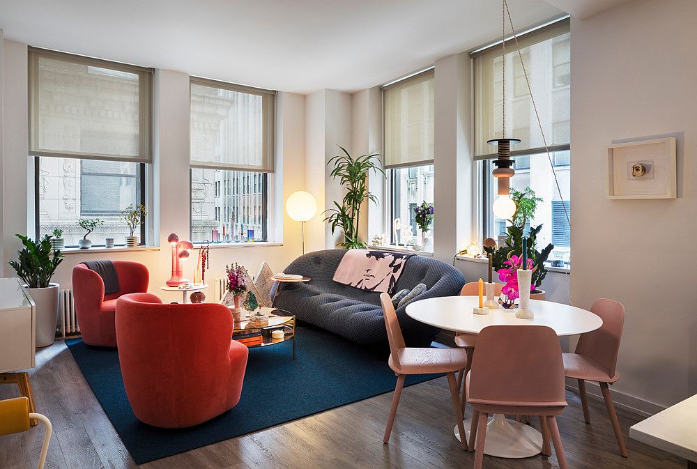 Small living area of New York City apartment is filled with a brilliant blend of colors