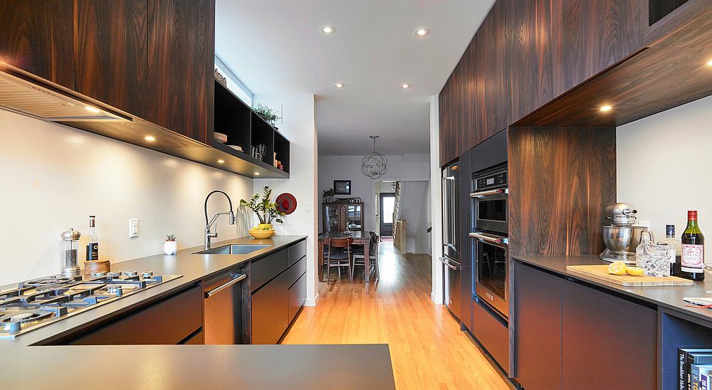 Spacious modern kitchen of the home with ample natural lighting coupled with recessed lights