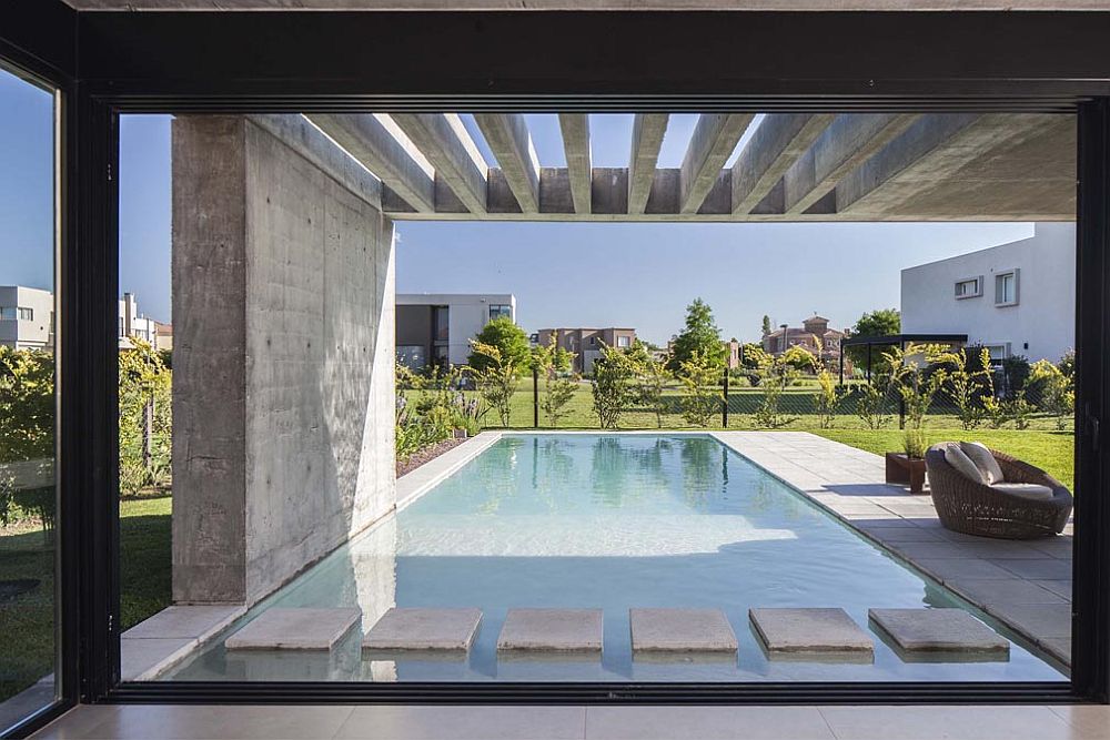Steeping stones across the pool add to the visual image of the backyard