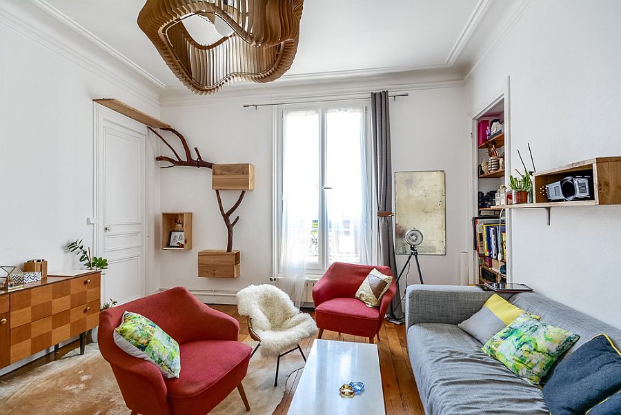 Tiny eclectic living room of Paris home with bright furniture and a dash of woodsy charm