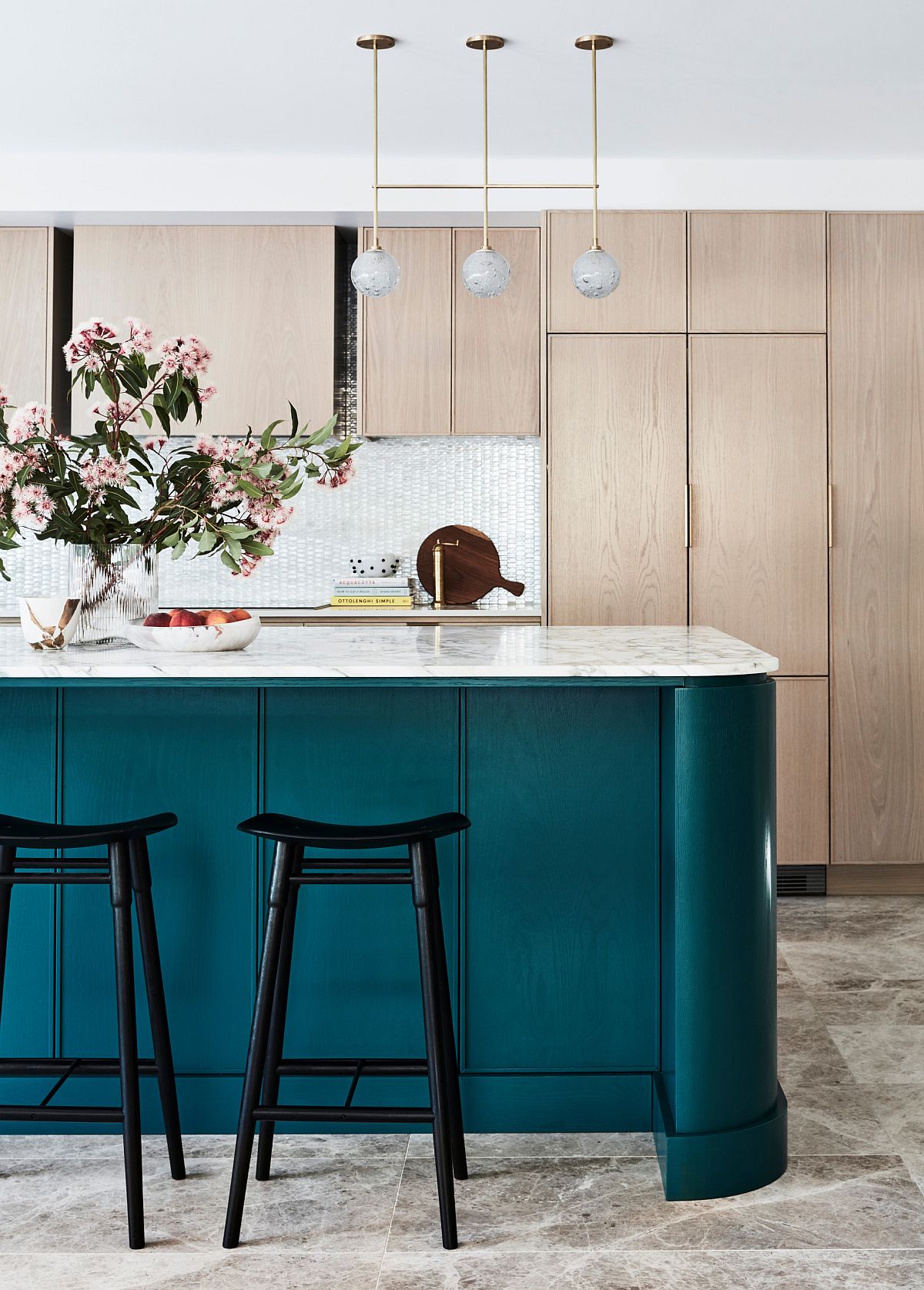 Touch of teal for the kitchen island brings color to the neutral space in white and gray