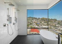 Trendy-and-stylish-bathroom-with-twin-rainfall-showerheads-and-a-freestanding-bathtub-18570-217x155