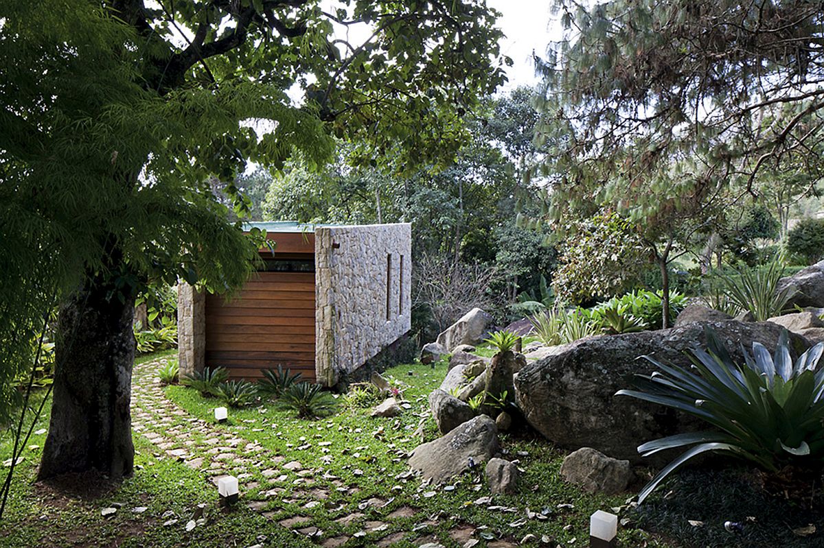 Understated front facade of the writer's studio borrows from the design of a cave