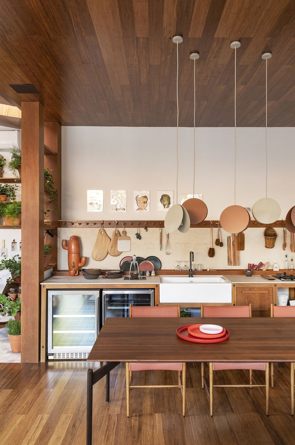 Unique pendant lights illuminate the dining area and blend into the backdrop