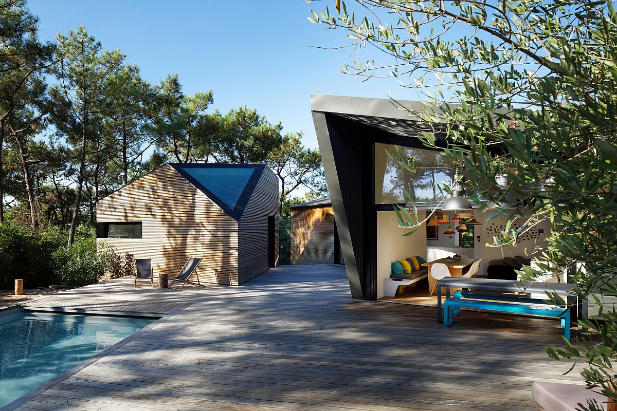 Unique triangular windows and openings bring geometric style to the fabulous holiday home