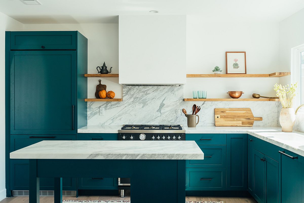 White marble finishes combined with bright teal cabinets inside the gorgeous modern kitchen