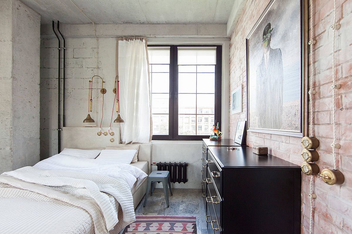 White sheer curtains, textured walls and metallic lighting fixtures combine to create this fabulous bedroom