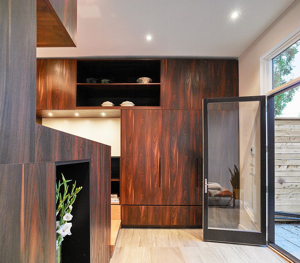 Wooden walls and cabinets reshape the interior of the house in Toronto