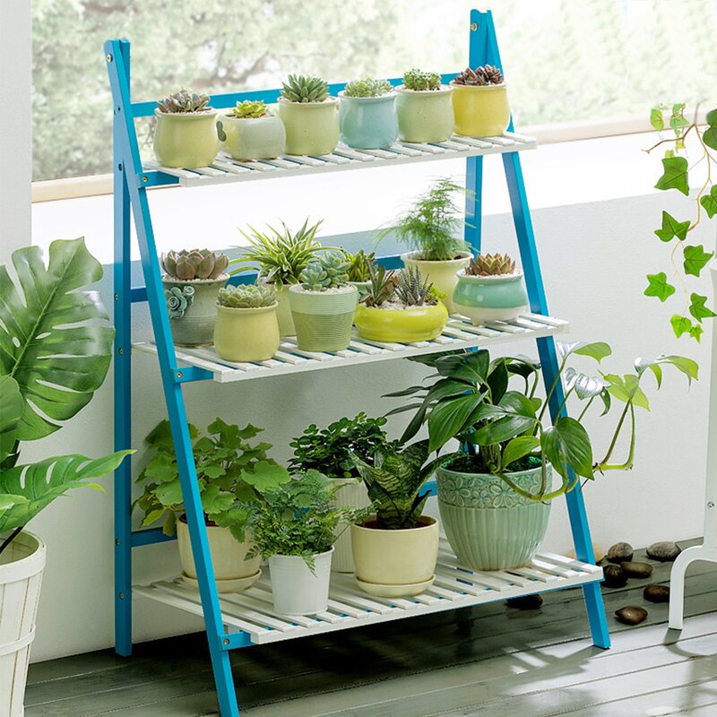 Bamboo ladder plant stand in blue and white