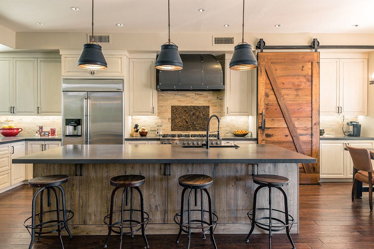 Bar stools and pendants bring edgy vibe to this kitchen