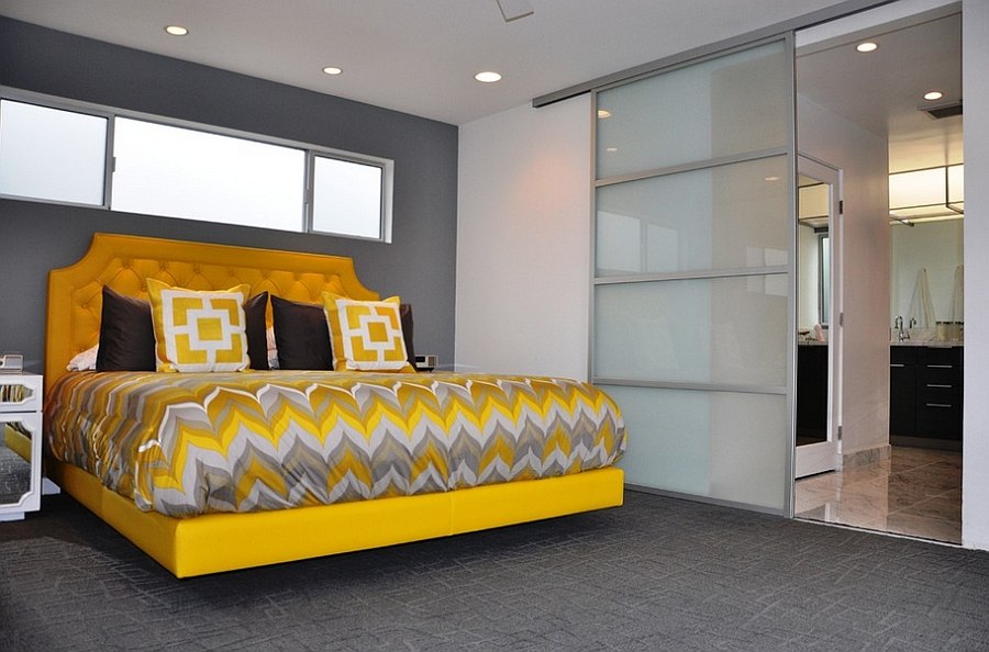 Charming and stylish bedframe in yellow grabs your attention in this mdoern gray bedroom