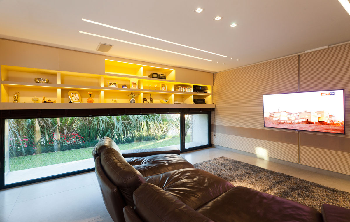 Custom TV room on the lower level with tech-savvy design and right acoustics