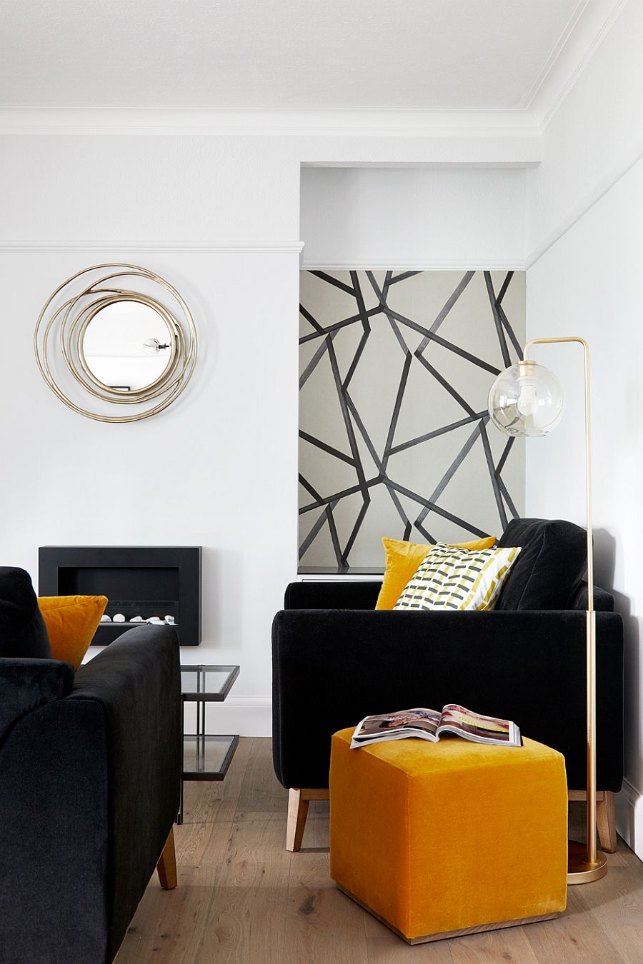 Dark sofa and club chairs coupled with yellow accents and side table in the living room