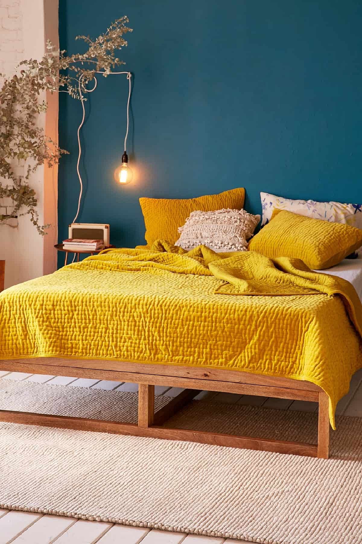 Darker yellows coupled with blue in the bedroom look absolutely gorgeous