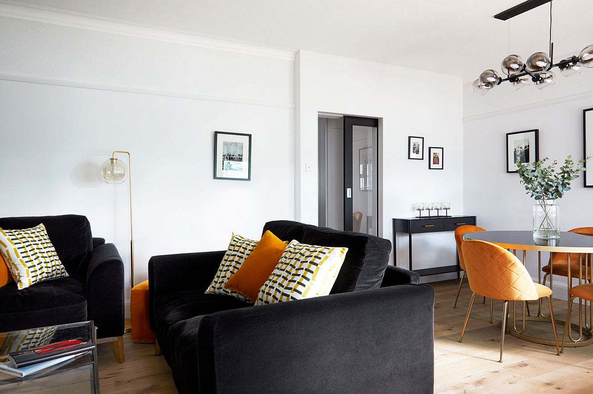 Dining table chairs and accent cushions add yellow to both the living area and dining room