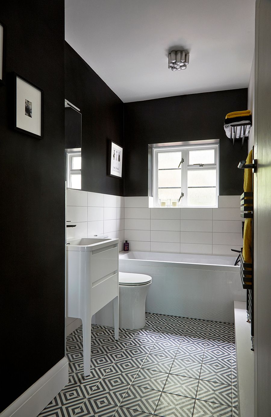 Eclectic contemporary bathroom in black and white with floor tiles that usher in pattern