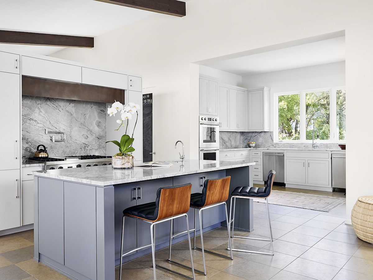 Fabulous kitchen in white with a light blue island and space-savvy design