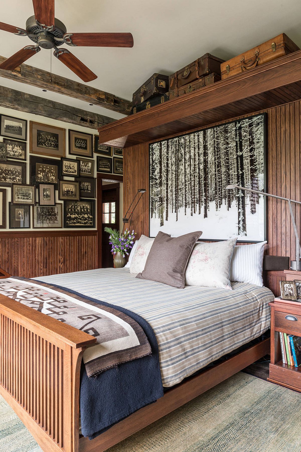 Gallery wall in this cabin style bedroom seems to take you down a trip in memory lane