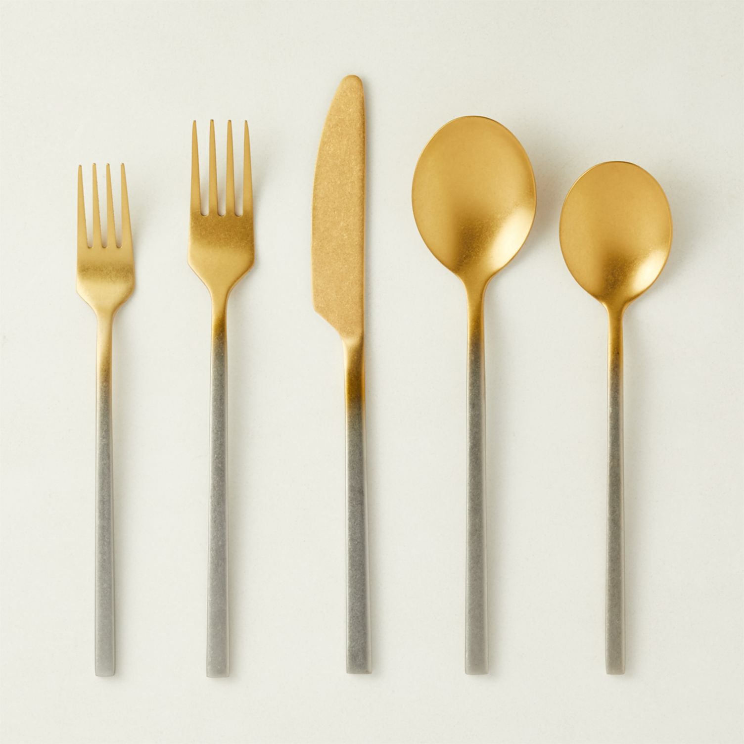 Gold and silver flatware set with faded effect