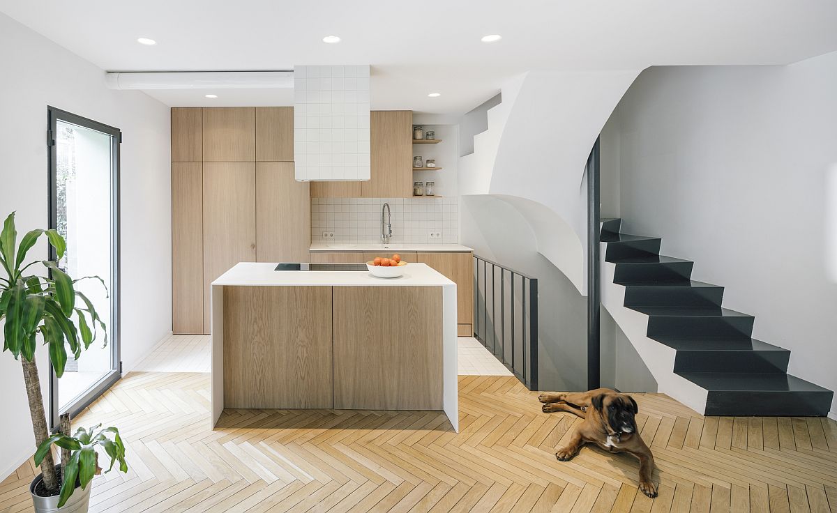 Gorgeous new kitchen of the Madrid house in white and wood with chevron pattern floor