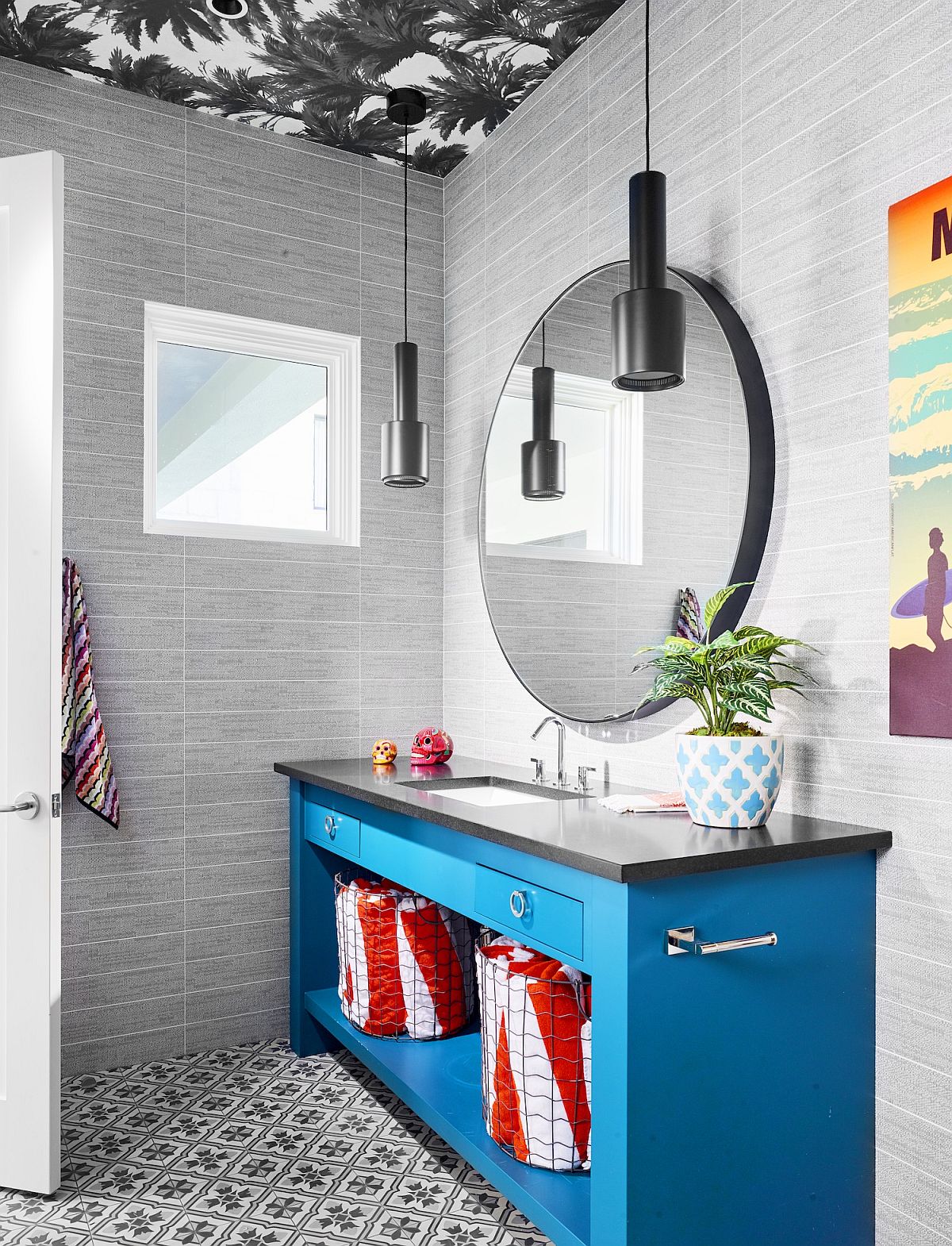 Gray powder room with wallpaper clad ceiling and a bright blue vanity that steals the show