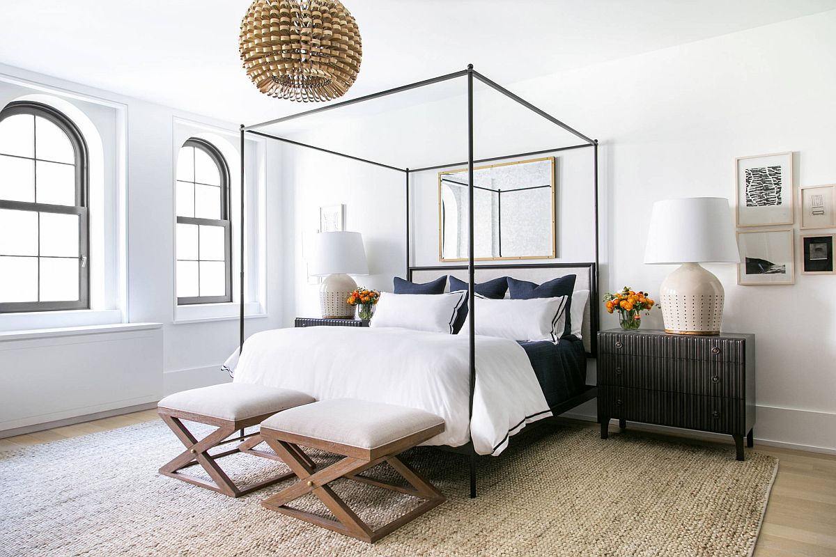 Minimal bedroom with a slim four-poster bed that steals the show with lovely use of straight lines