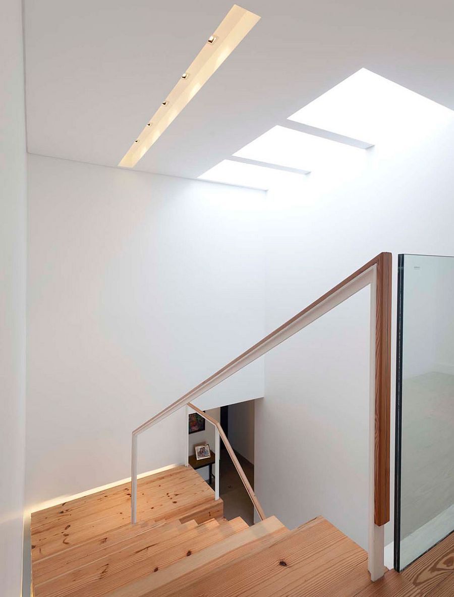 Natural light makes its way into the stairwell thanks to a skylight