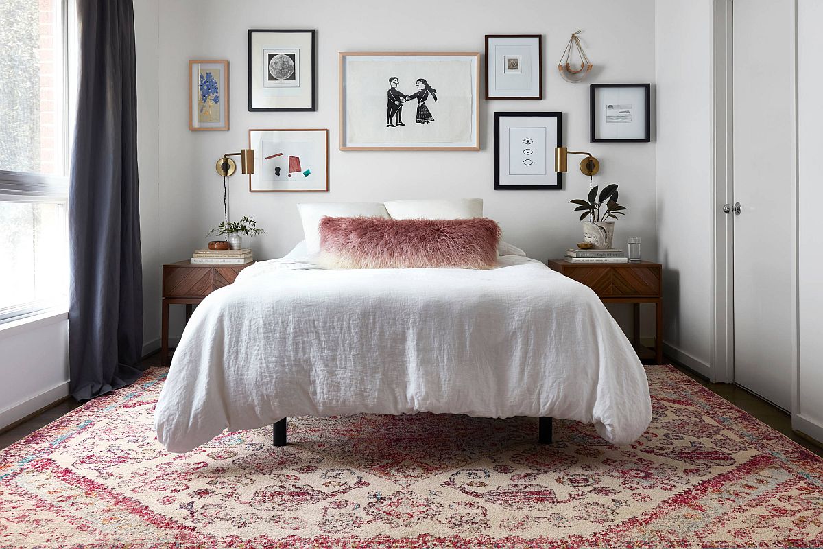 Simple and dashing gallery wall in the small, white eclectic bedroom