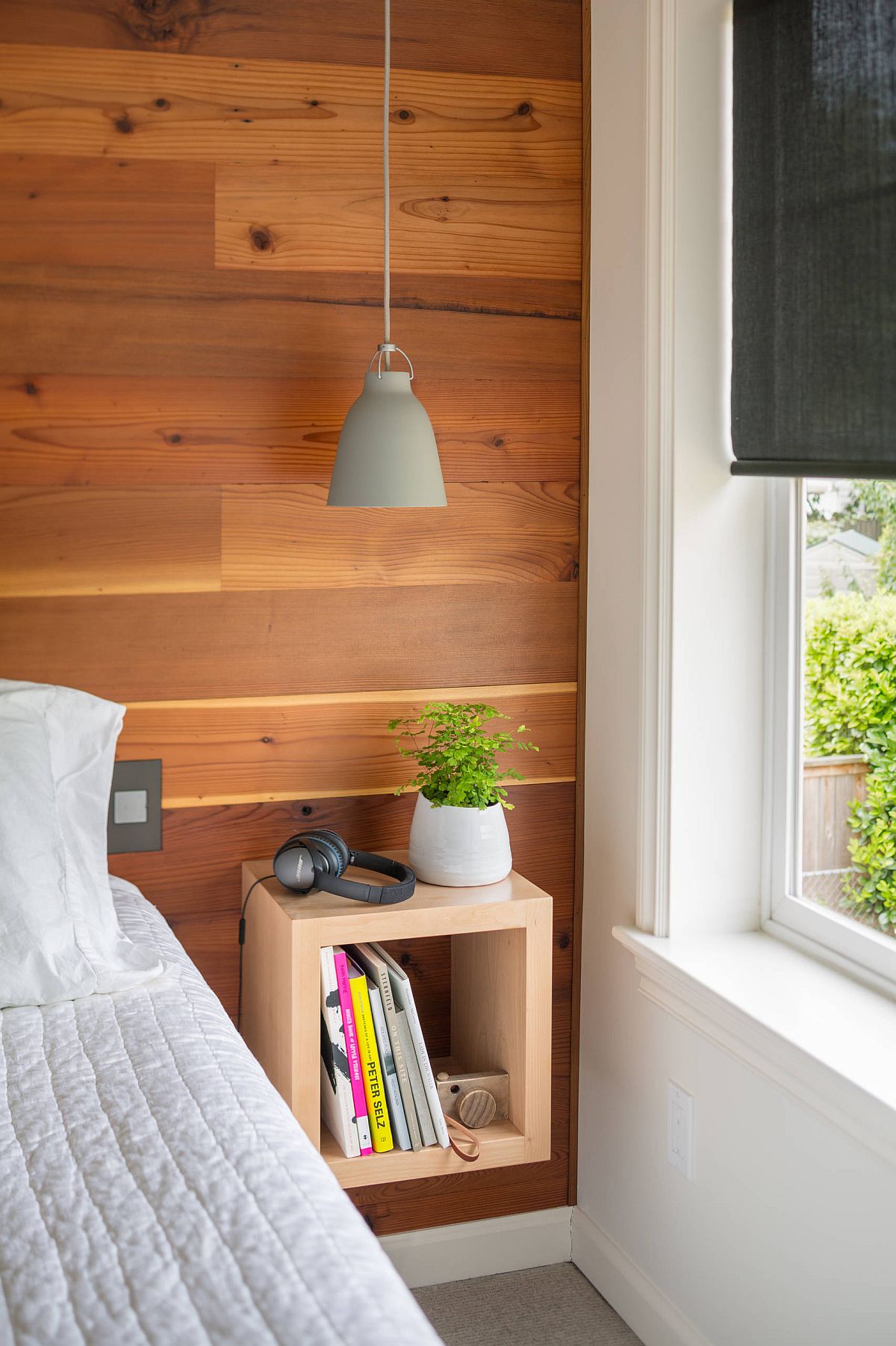 Sleek gray bedside pendant saves space and illuminates the corner