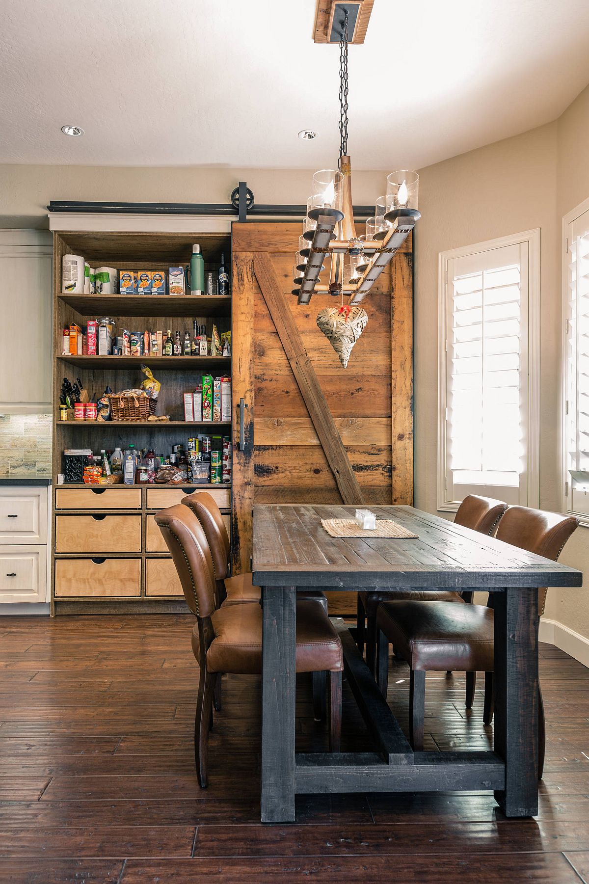 Sliding barn style door is just perfect for the industrial-farmhouse style kitchen