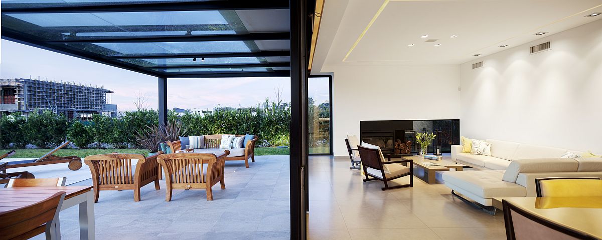 Sliding glass doors connect the kitchen with the outdoor space