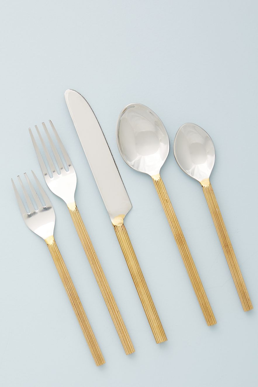 Stainless-steel-flatware-with-hand-carved-gold-toned-handles-87833