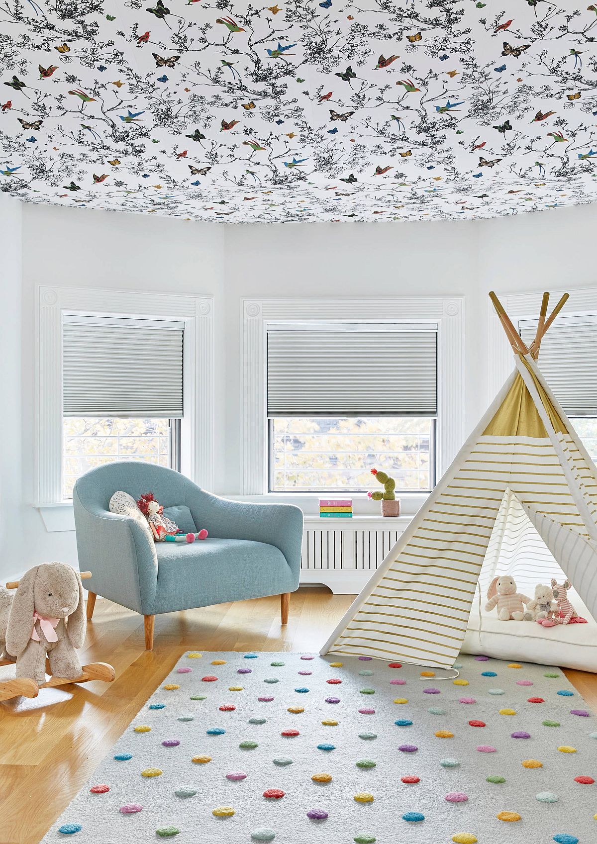 Vivacious butterfly and birds ceiling wallpaper fills this girls' room with fun pattern