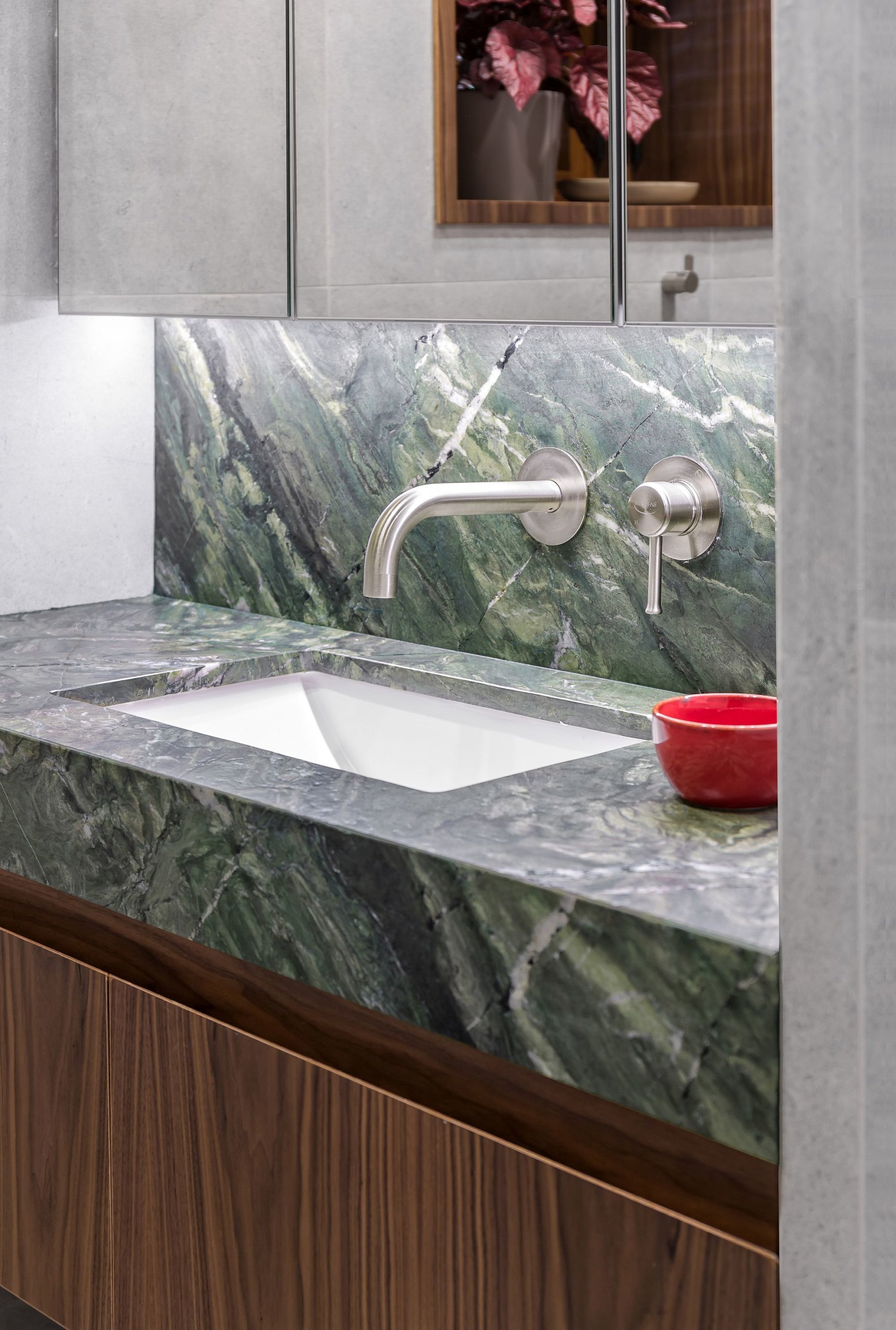 American walnut and green marble vanity in the modern bathroom
