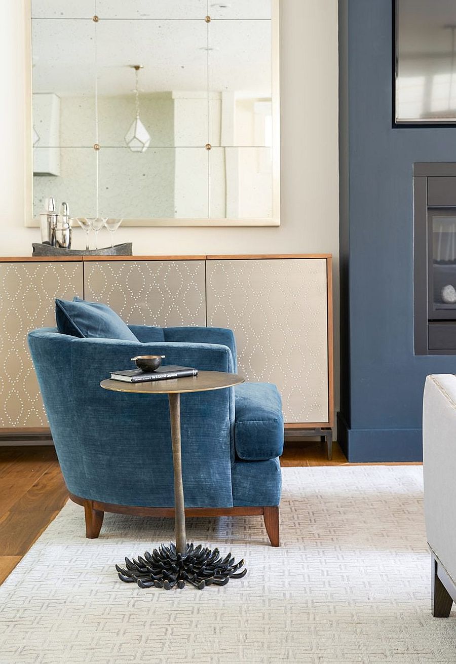 Blue Club chair and slim metallic side table next to the lovely home bar