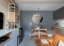 Blue-gray-and-wood-shape-the-social-zone-and-kitchen-on-the-lower-level-of-the-duplex-15275-217x155