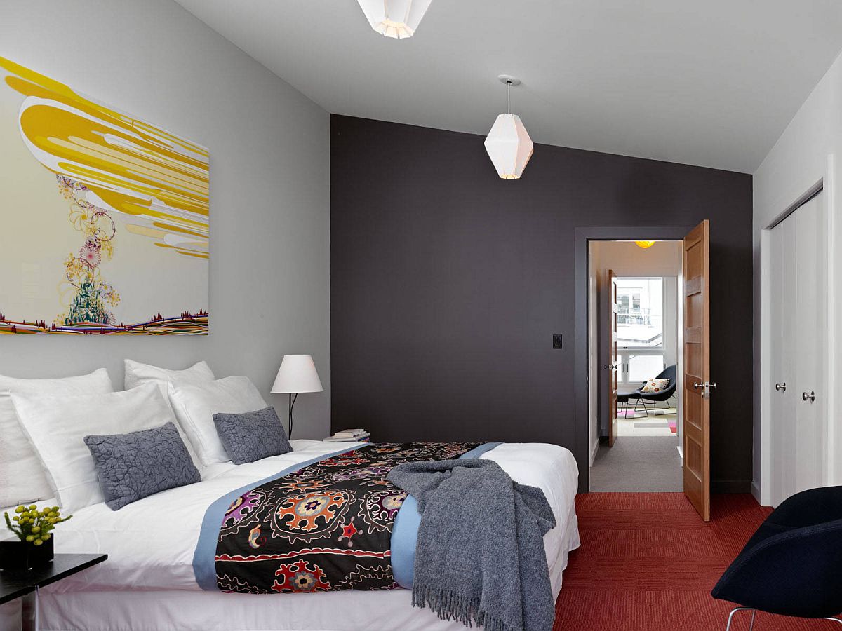 Color-filled contemporary bedroom in San Francisco with a smart dark gray accent wall