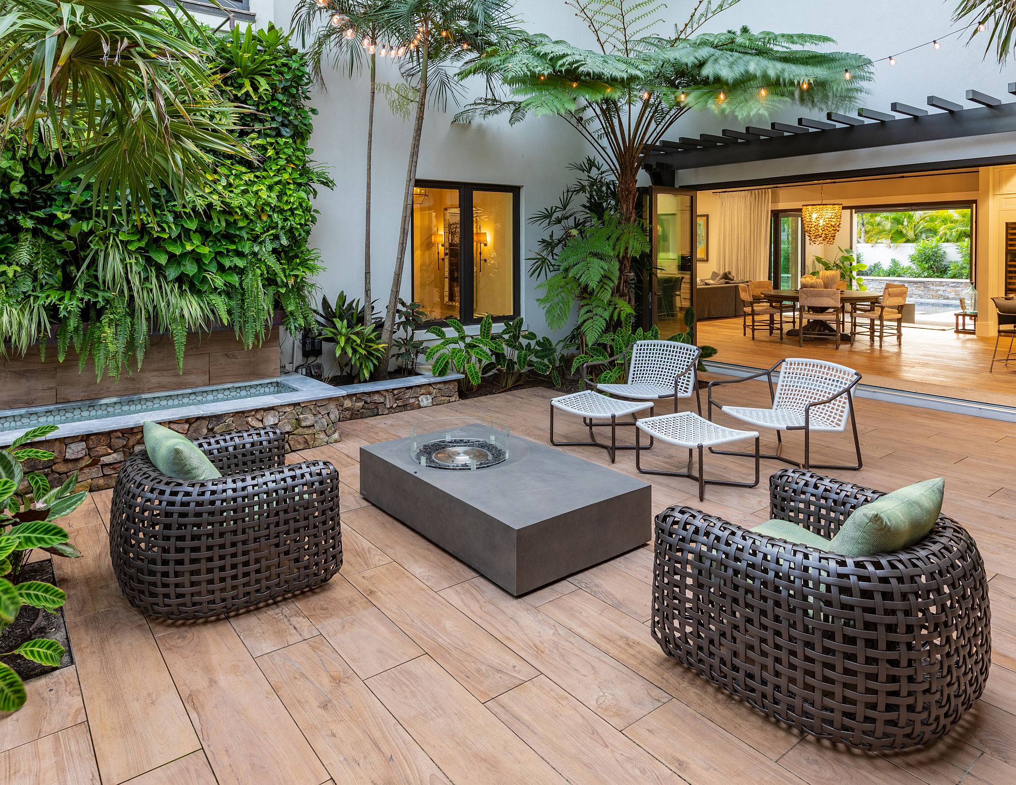 Courtyard of the house feels like an organic extension of the great room and also leads to the outdoor kitchen